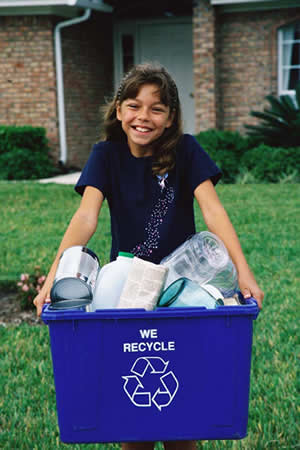 girl carrying recycling 